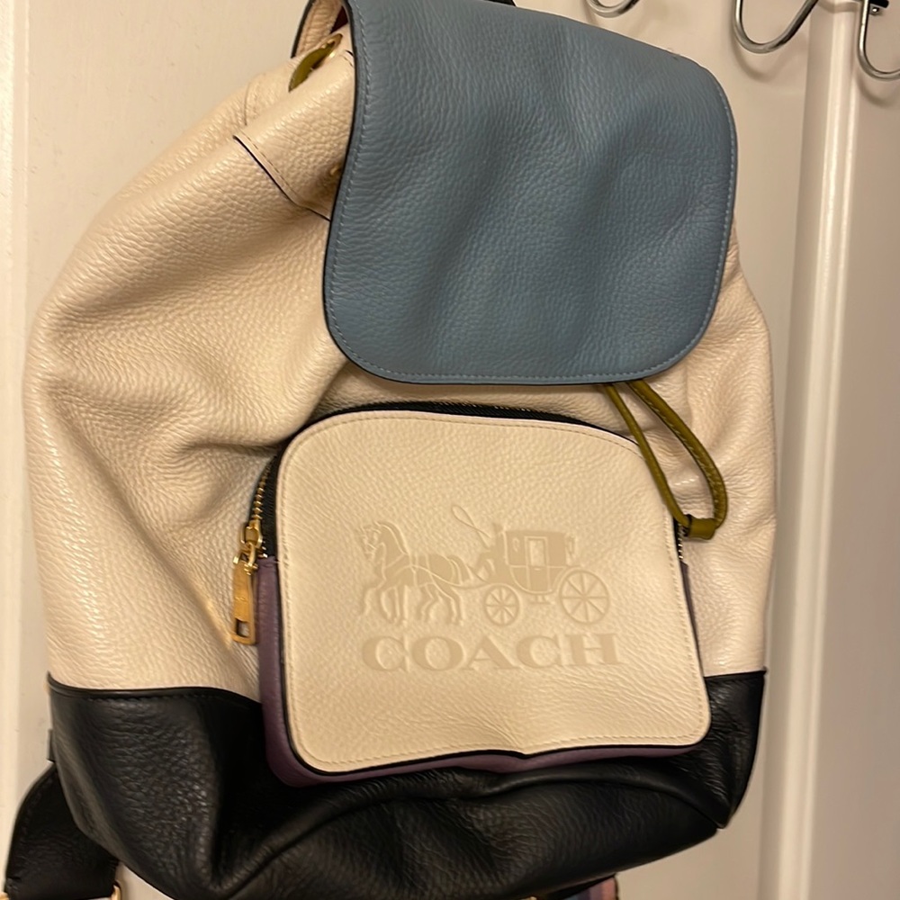 Selling this beautiful backpack it is white with multiple colors for the straps!
